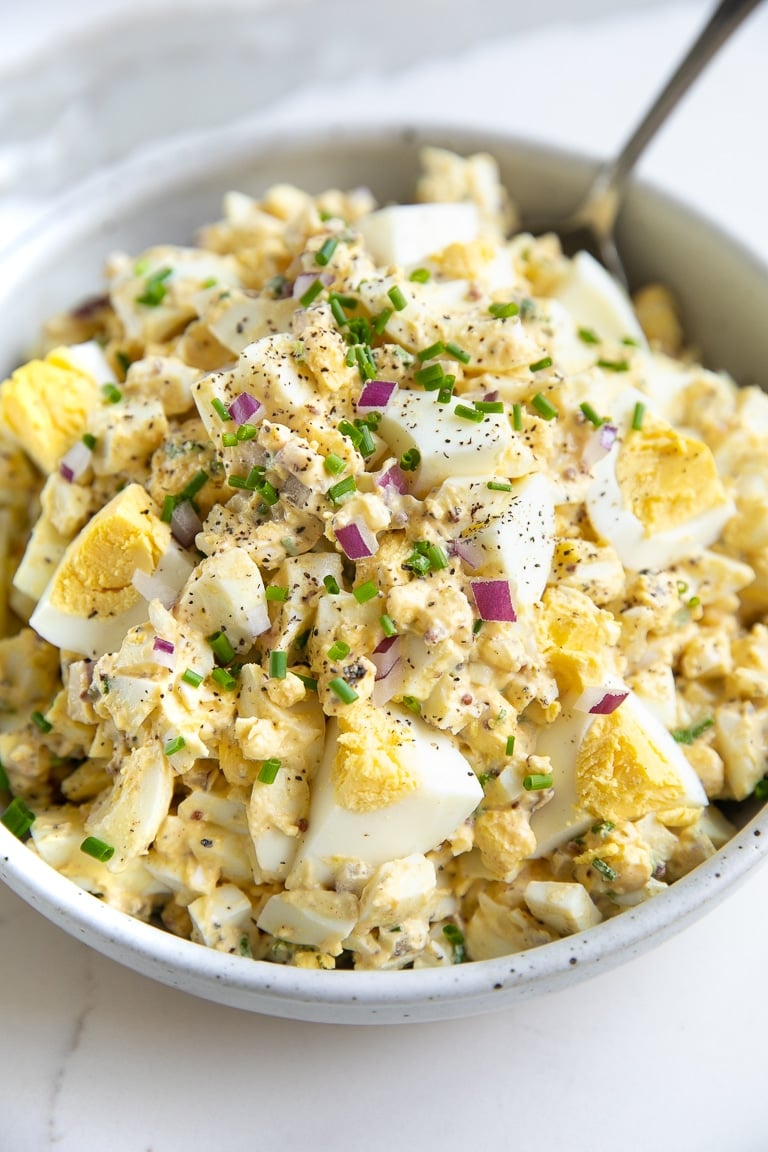 Shallow bowl filled with egg salad.