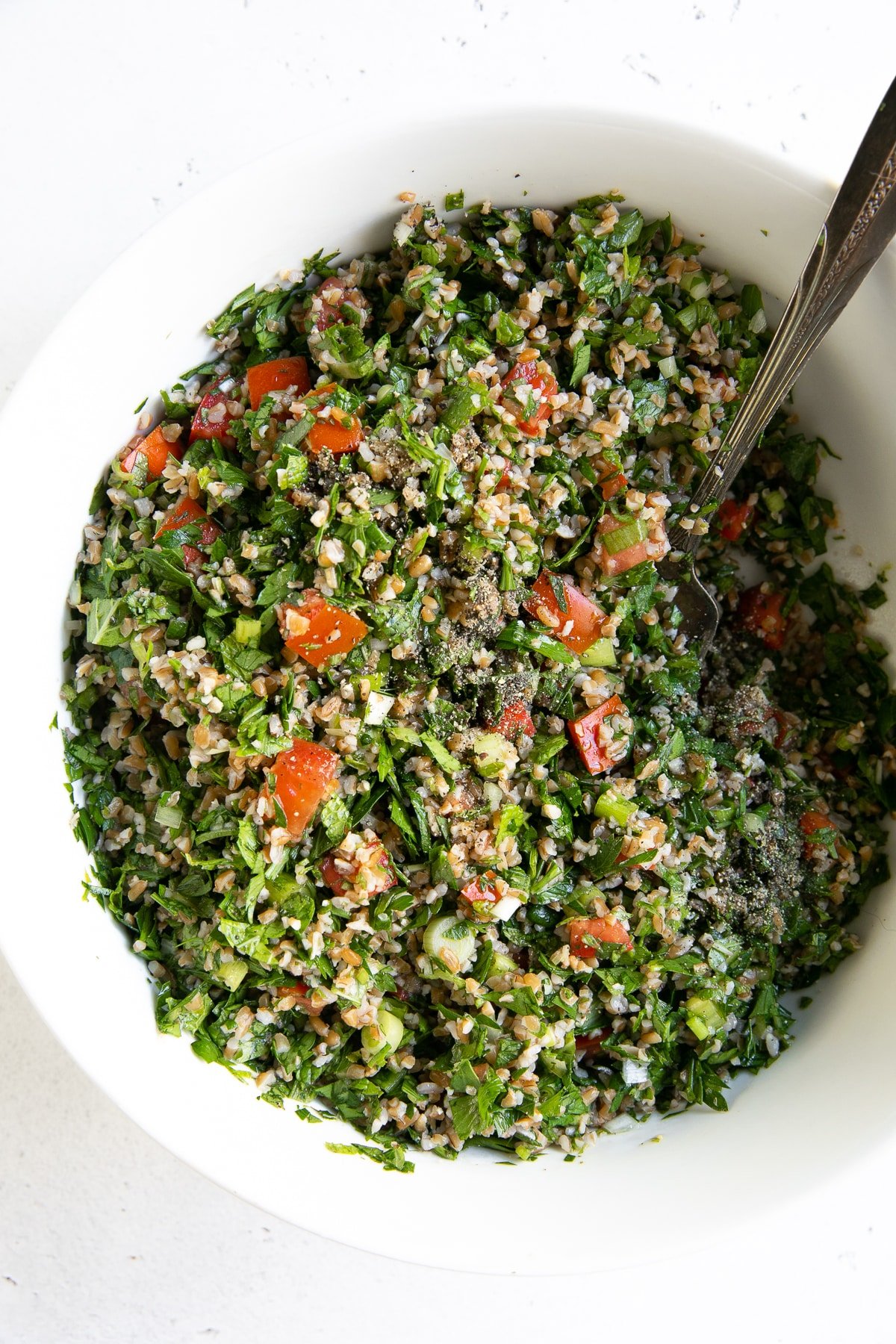 White bowl filled with prepared Tabbouleh salad.