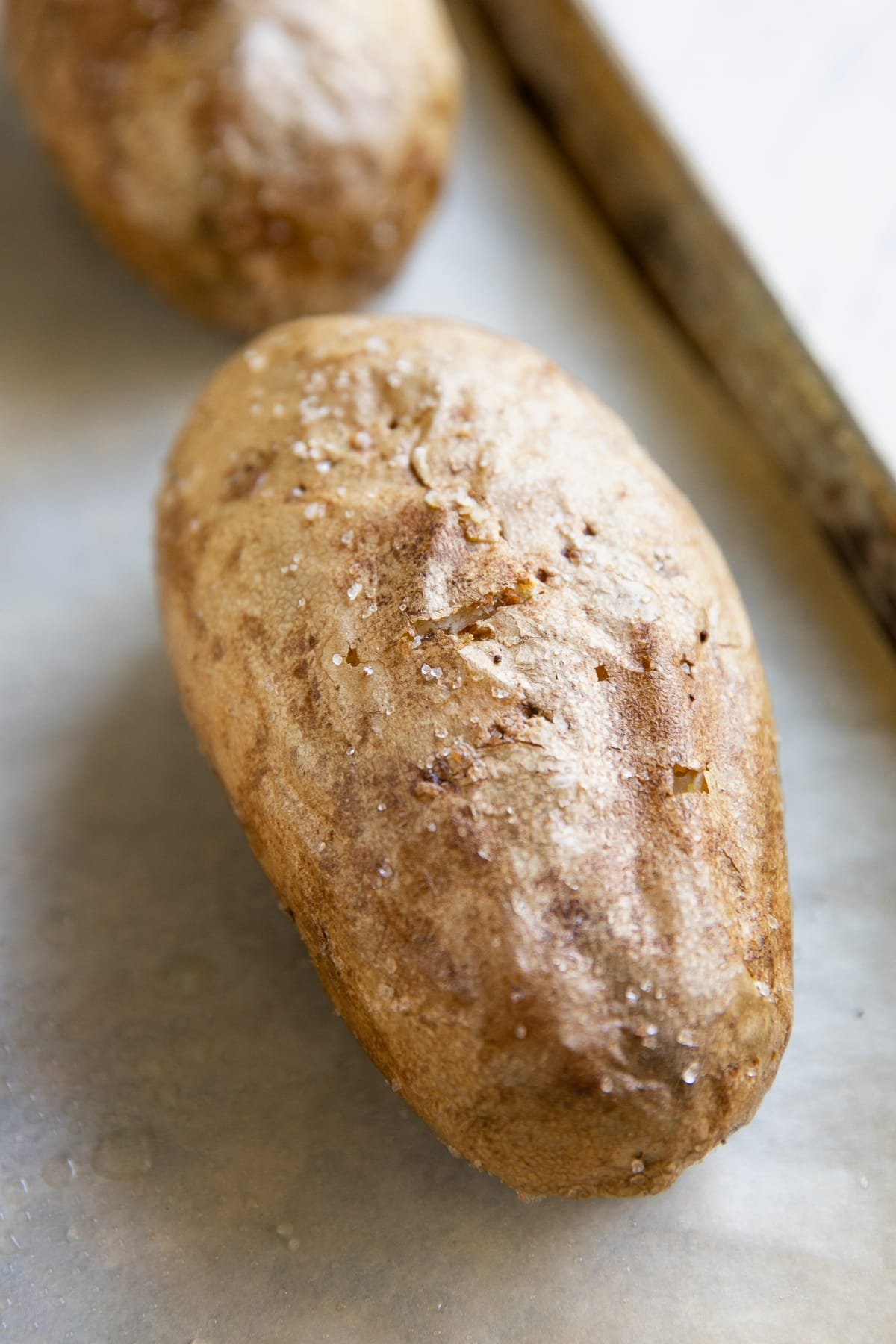 Baked potato on a baking sheet.