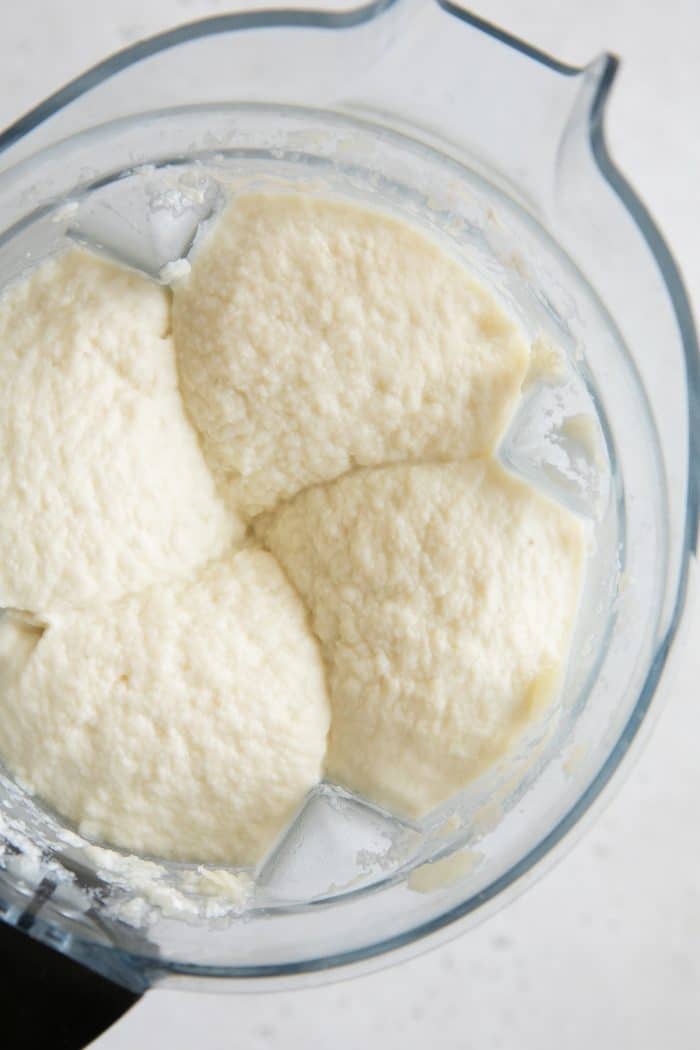 Fully blended creamy mashed cauliflower in a large blender.