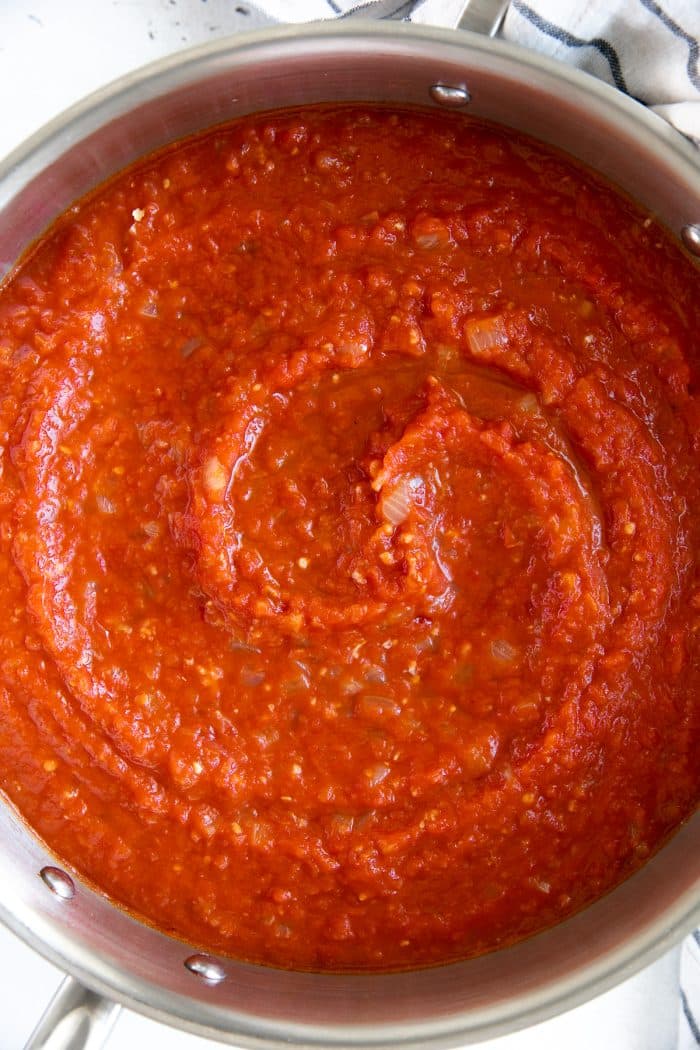 Pot filled with cooked and blended Arrabbiata sauce.