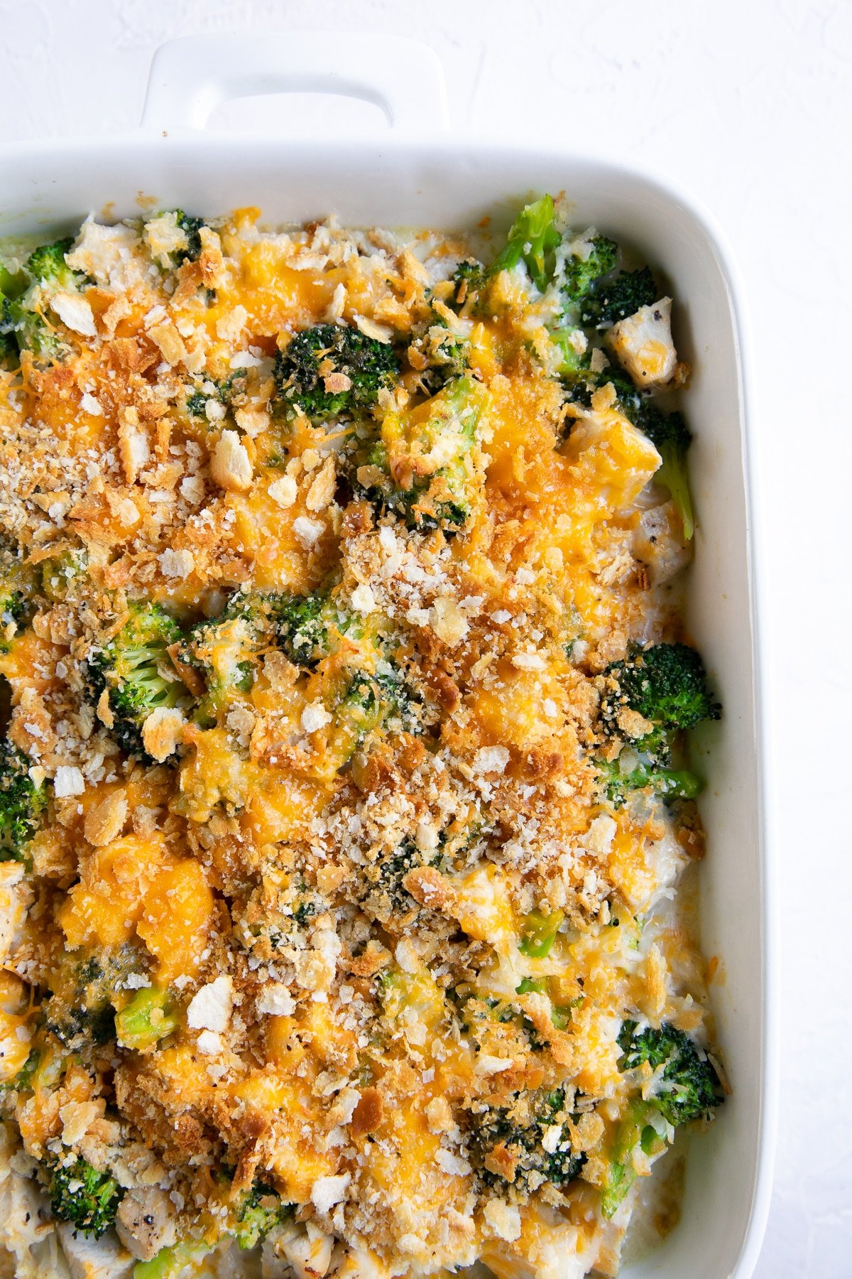 Cooked Chicken Broccoli Rice Casserole in a white casserole dish.