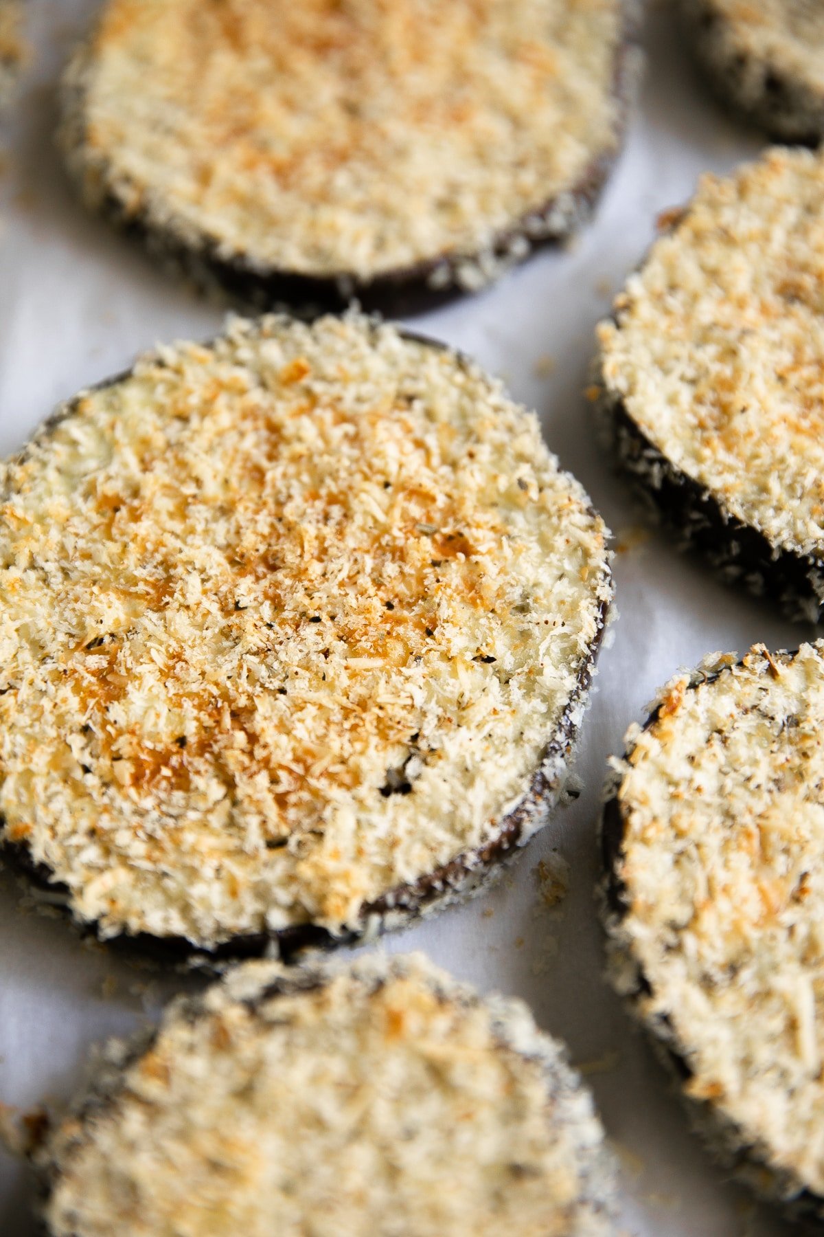 Crispy baked eggplant slices breaded with panko and parmesan cheese.