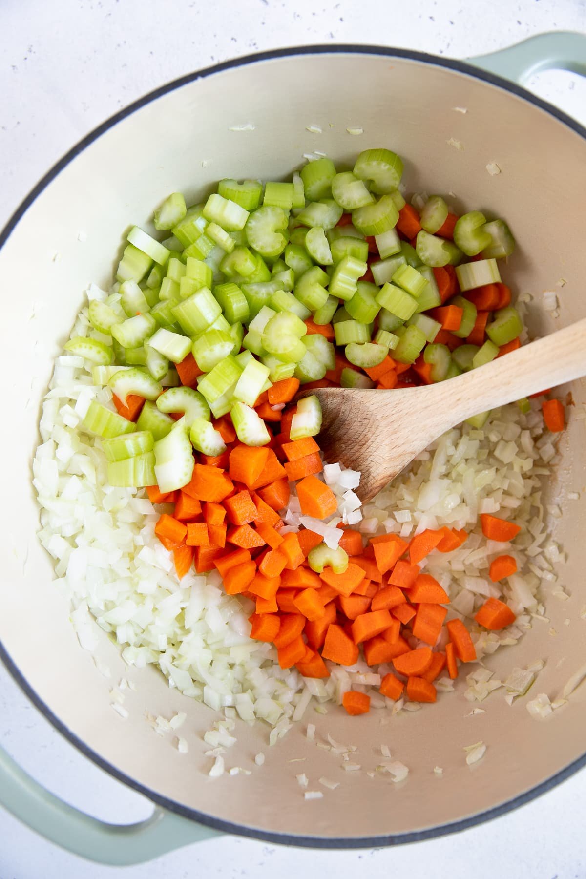 Mirepoix cooking in a large pot.