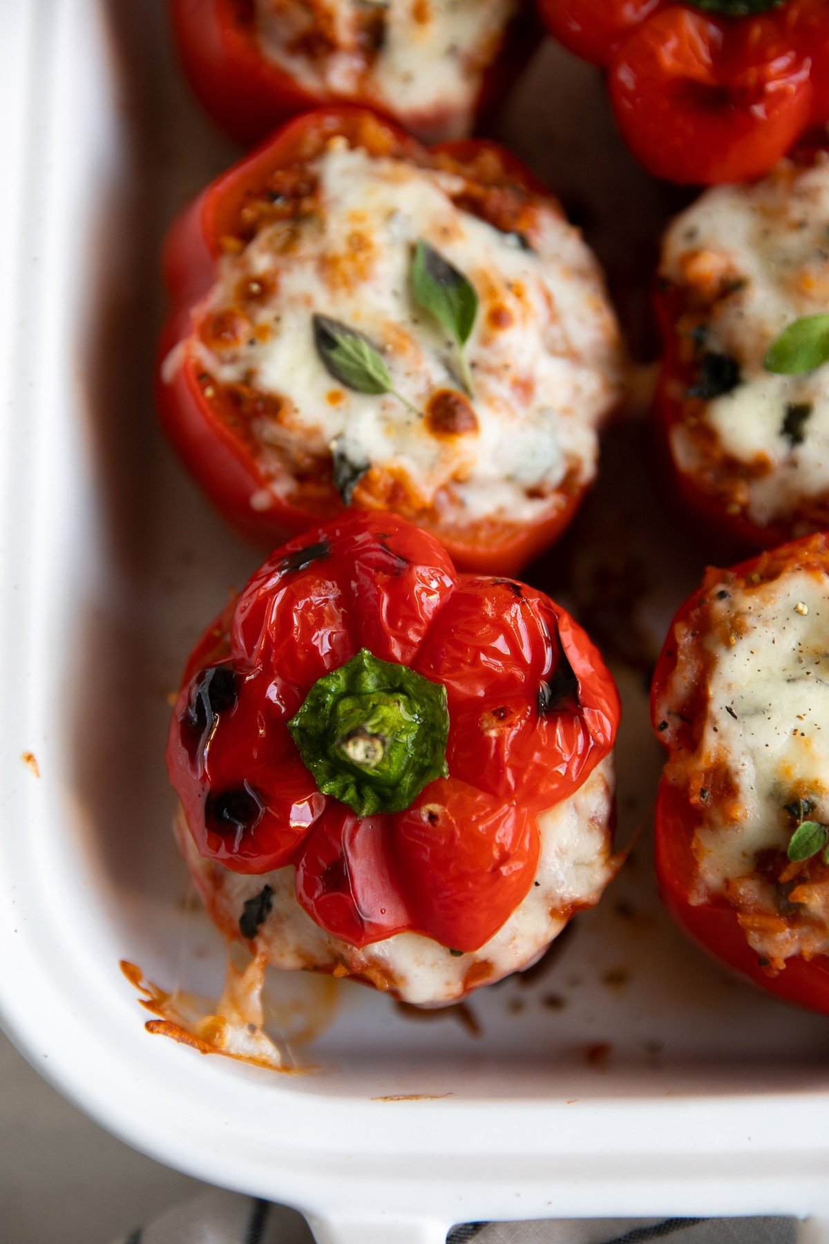 Stuffed and baked red bell peppers topped with mozzarella cheese and fresh oregano.