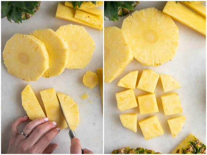 Cutting a pineapple into small chunks.