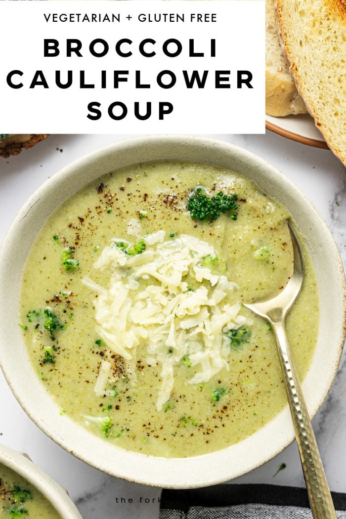Vertical Pinterest pin featuring a close-up overhead photo of broccoli cauliflower soup in a beige bowl. The soup is creamy pale green with small broccoli bits, topped with shredded cheddar and cracked black pepper, and a gold-handled spoon resting in the bowl. Toasted bread slices appear at the top right, and a black-and-white striped towel is visible at the bottom right. A white text box across the top includes black text “VEGETARIAN + GLUTEN FREE” and large bold title text “BROCCOLI CAULIFLOWER SOUP.” Small site text “theforkedspoon.com” appears near the bottom.