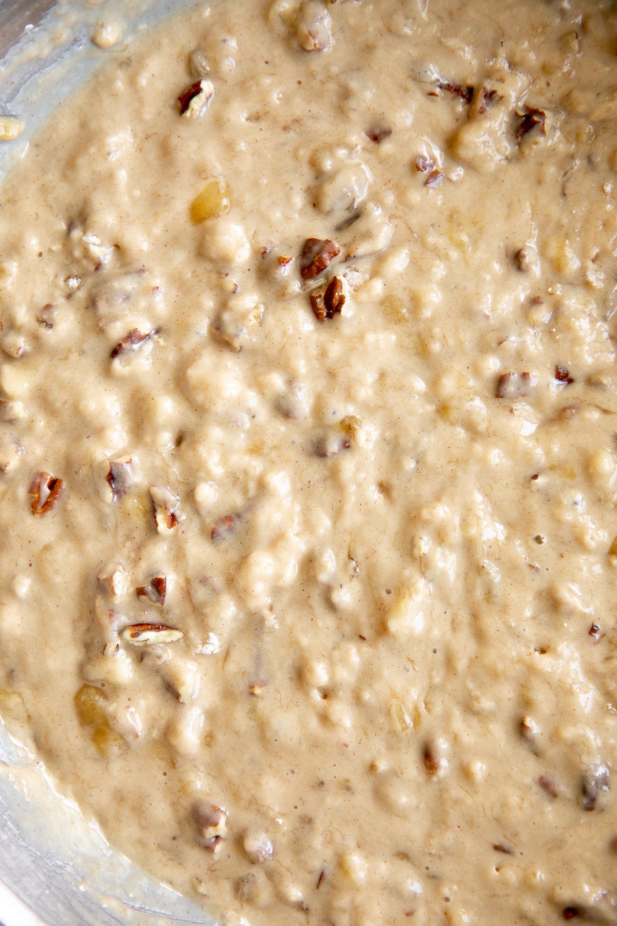 Large bowl filled with banana nut muffin batter.