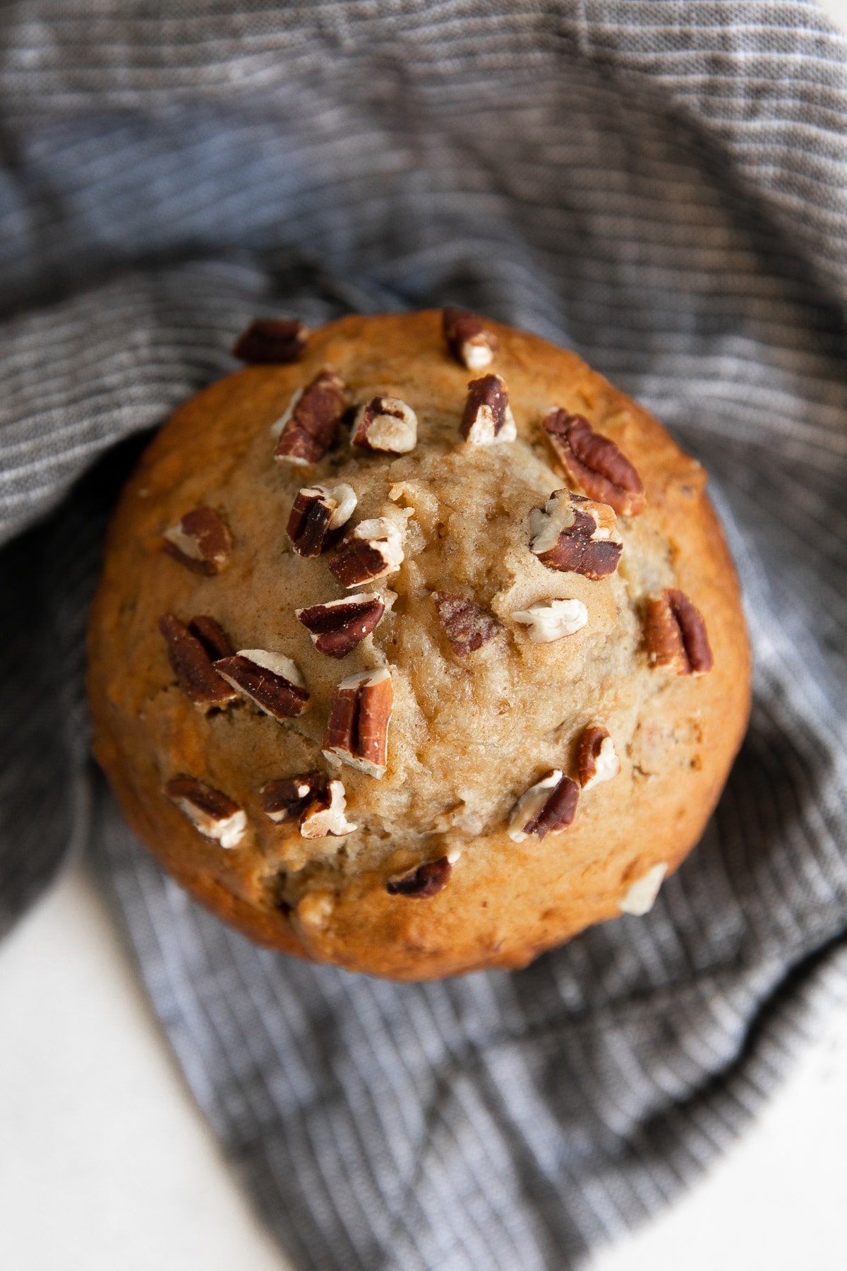 Single overhead image of a banana nut muffin.