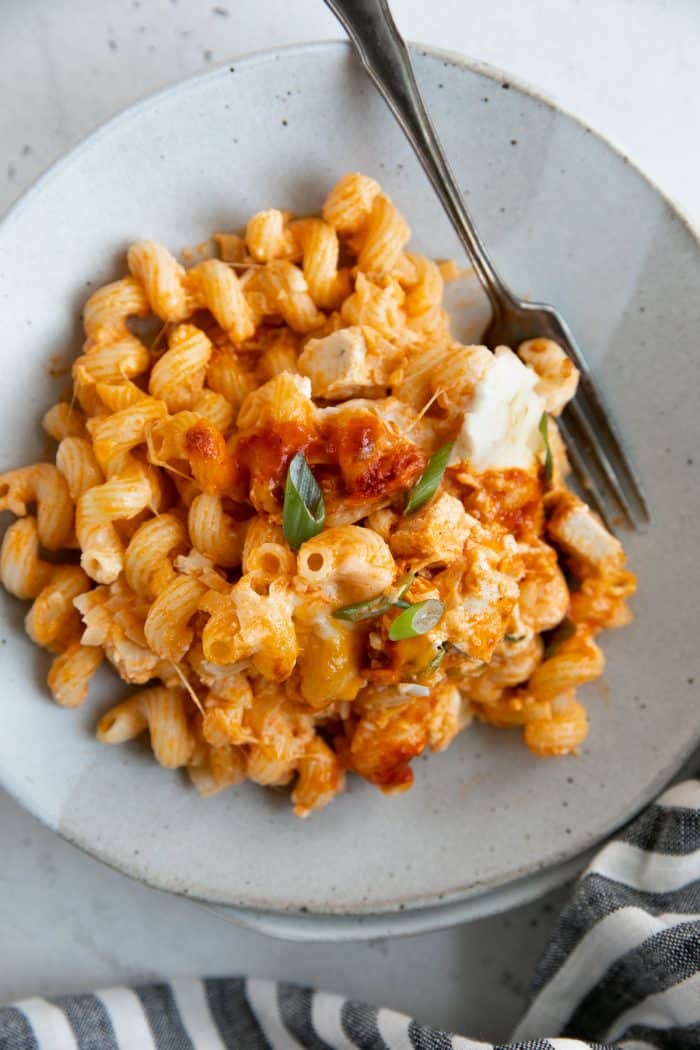 Small serving plate with one helping of buffalo chicken pasta.