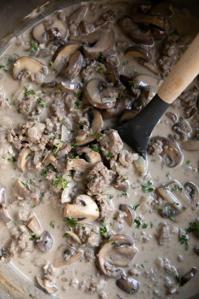 Ground beef and mushrooms simmering in a rich our cream stroganoff sauce.