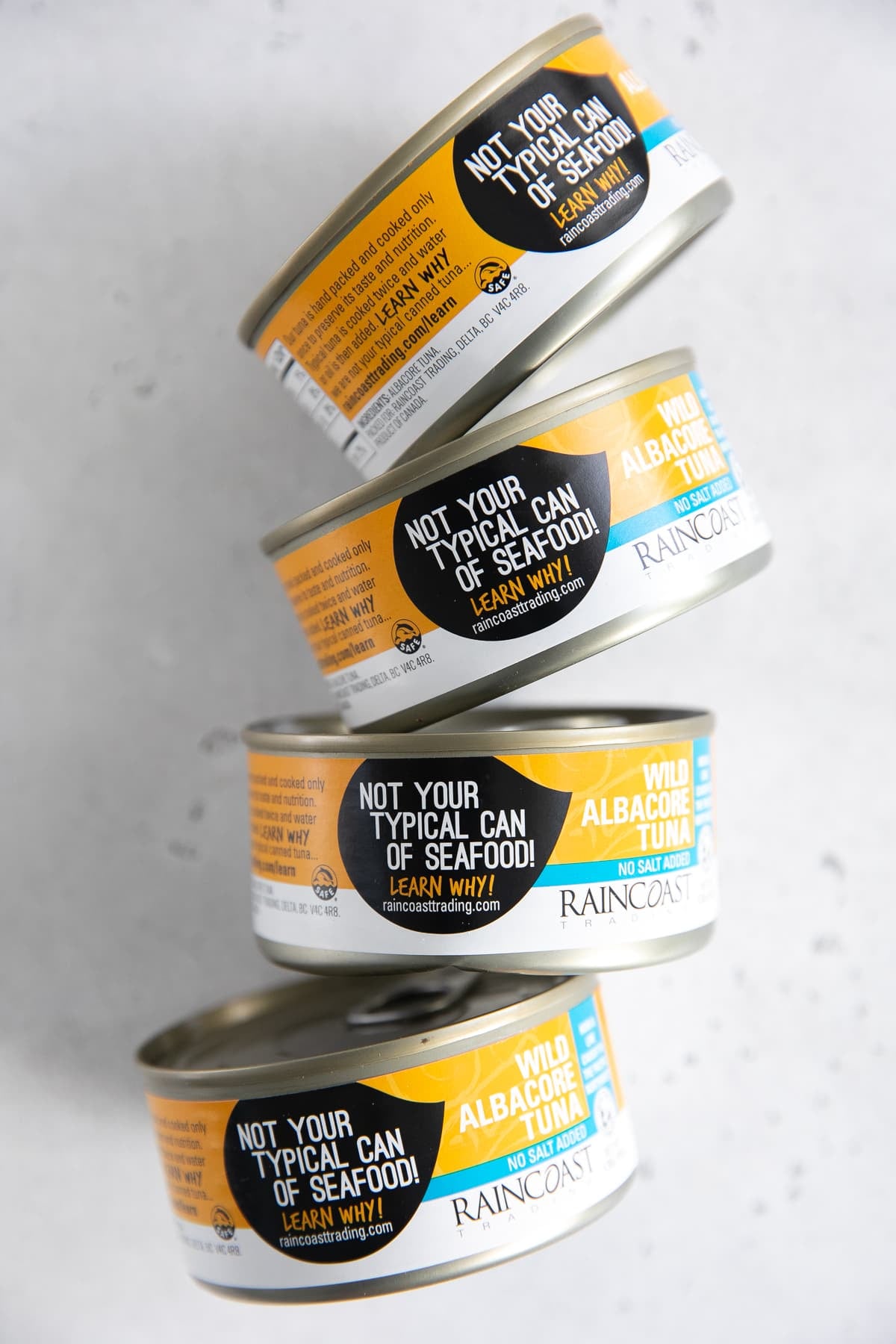 Four cans of tuna in water.