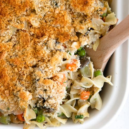 Crispy golden casserole made with canned tuna, noodles, and a homemade sauce with frozen peas and carrots.