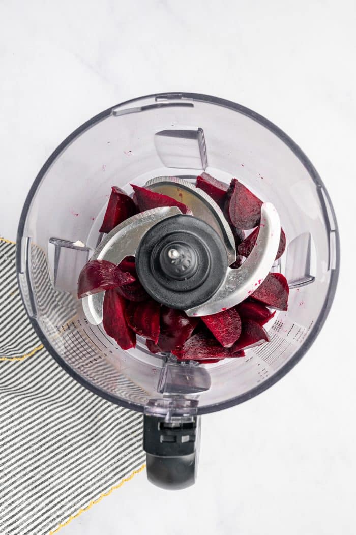 Cooked beets added to a food processor.