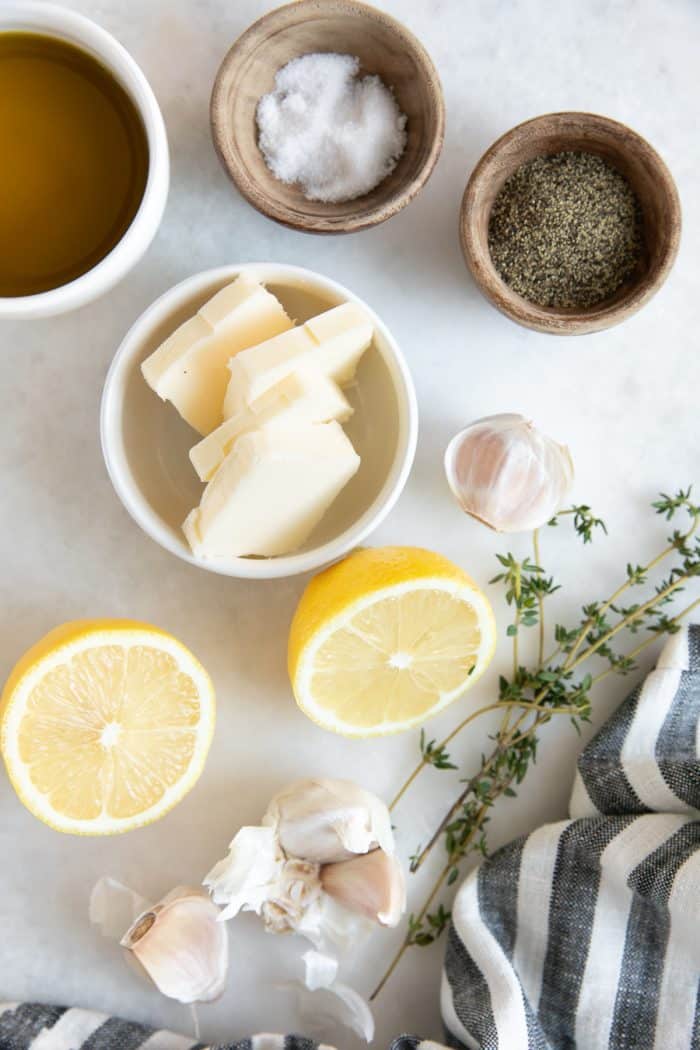 Ingredients needed to make lemon chicken breasts in the oven.