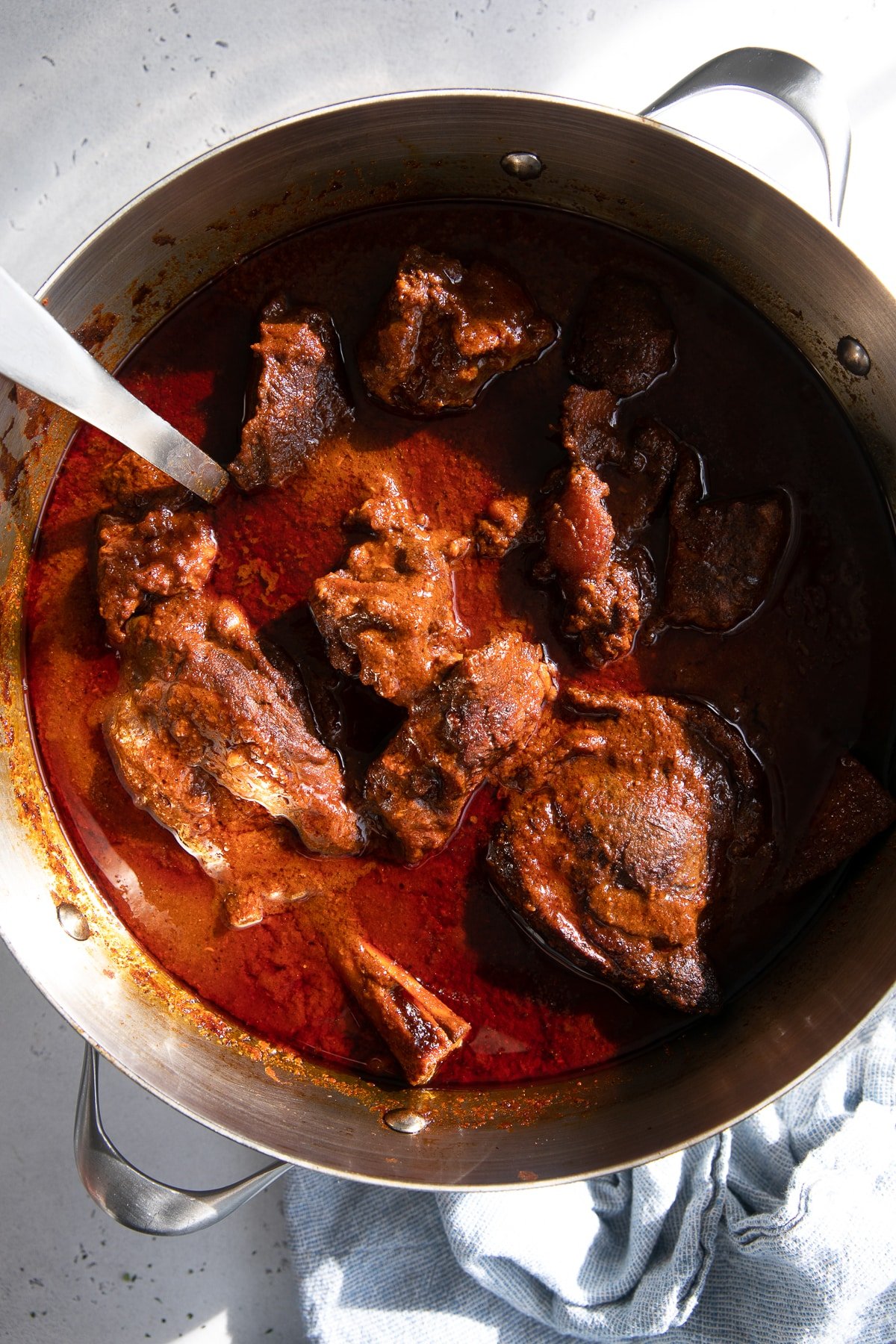 Large pot filled with Mexican birria made with beef and lamb.