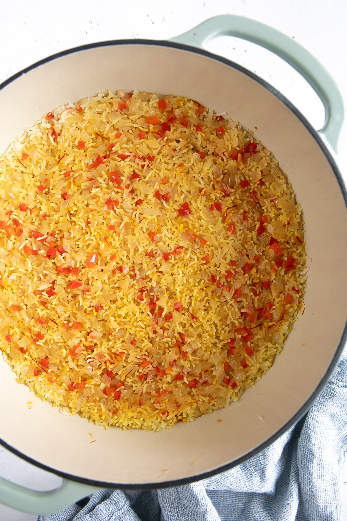 Cooked Spanish rice before being fluffed with a fork.