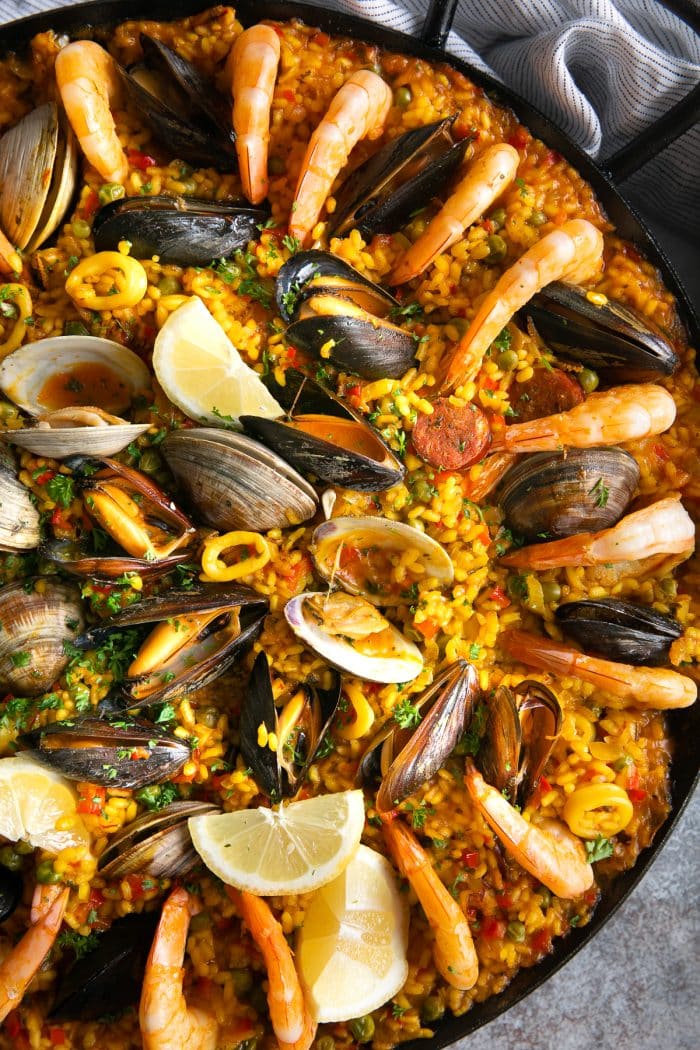 Paella filled with mussels, clams, shrimp, calamari, spanish chorizo, and saffron rice.