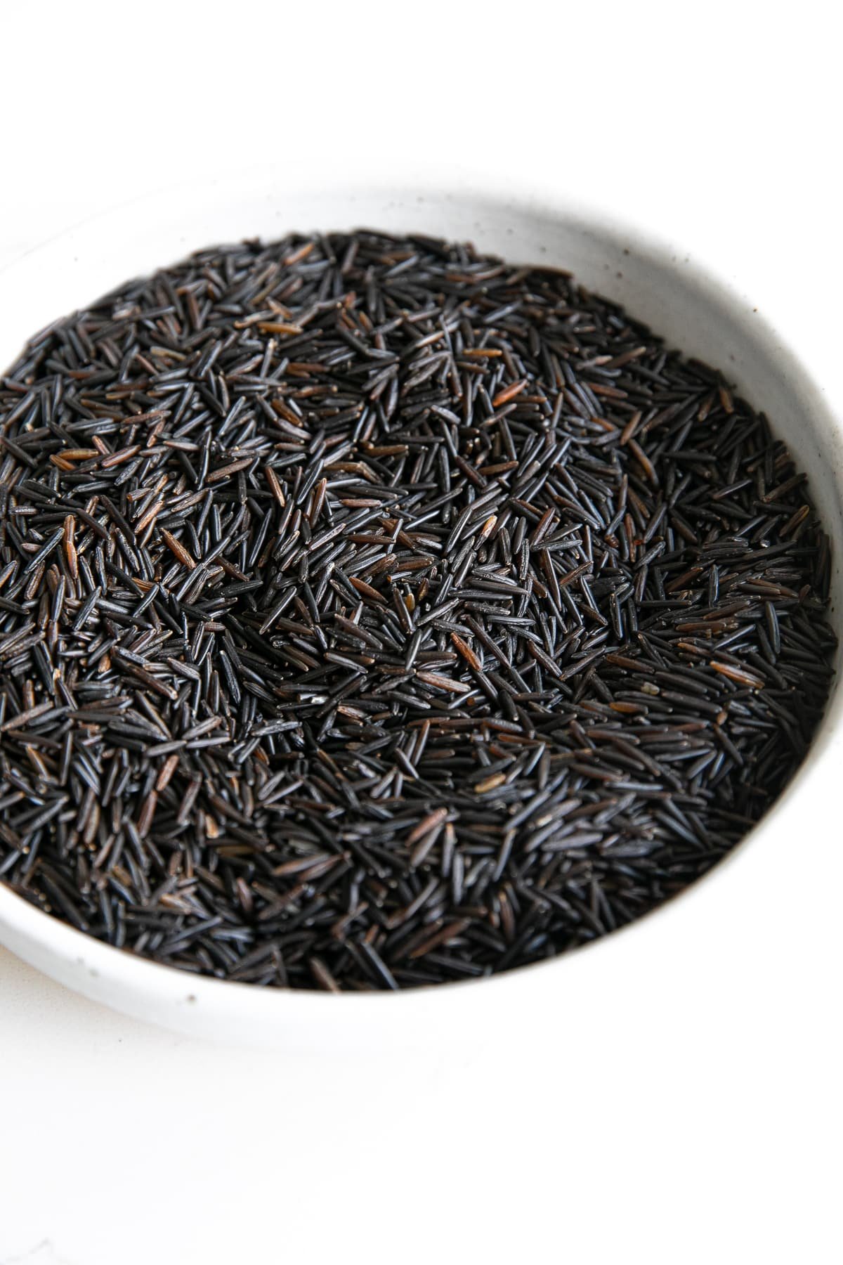 Bowl filled with cultivated wild rice.