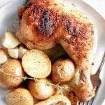 Pinterest Pin image for the oven-baked chicken legs with baby potatoes with one image and text overlay.