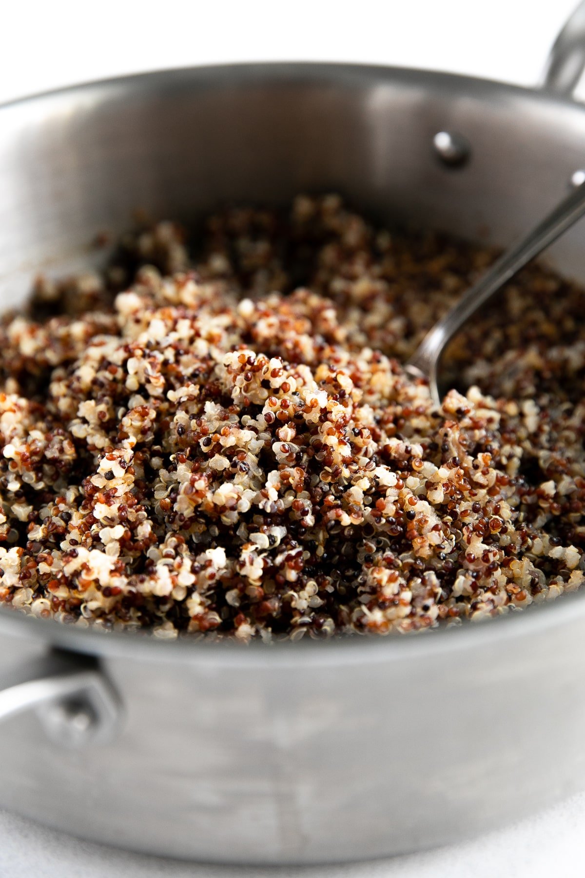 Cooked quinoa in a large saucepot.