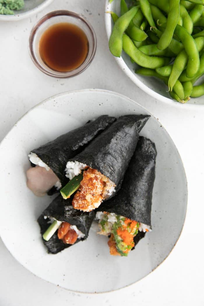 Plate filled with four hand rolls