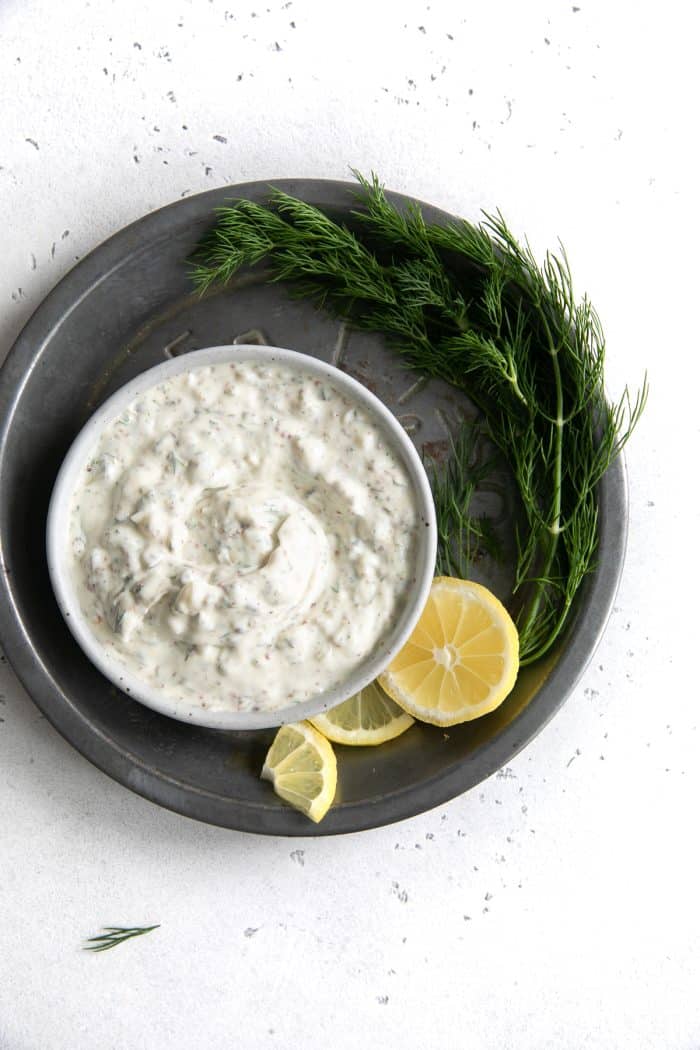 Tartar sauce in a small white serving dish on an aluminum pan.