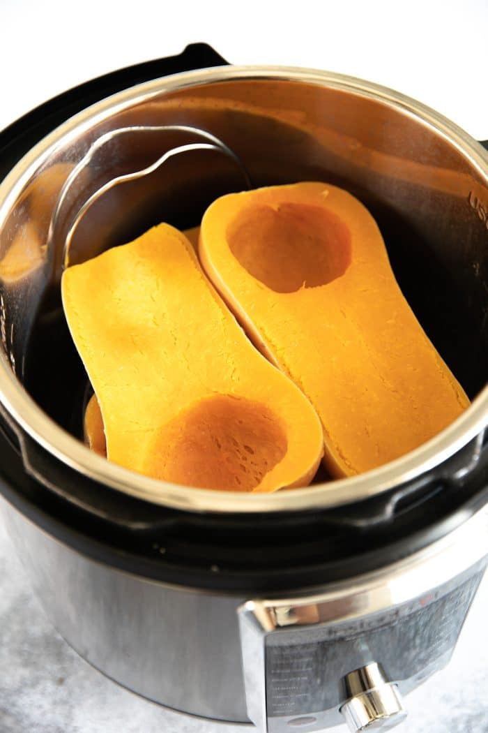 Two whole butternut squash, halved, and cooked in an Instant Pot.