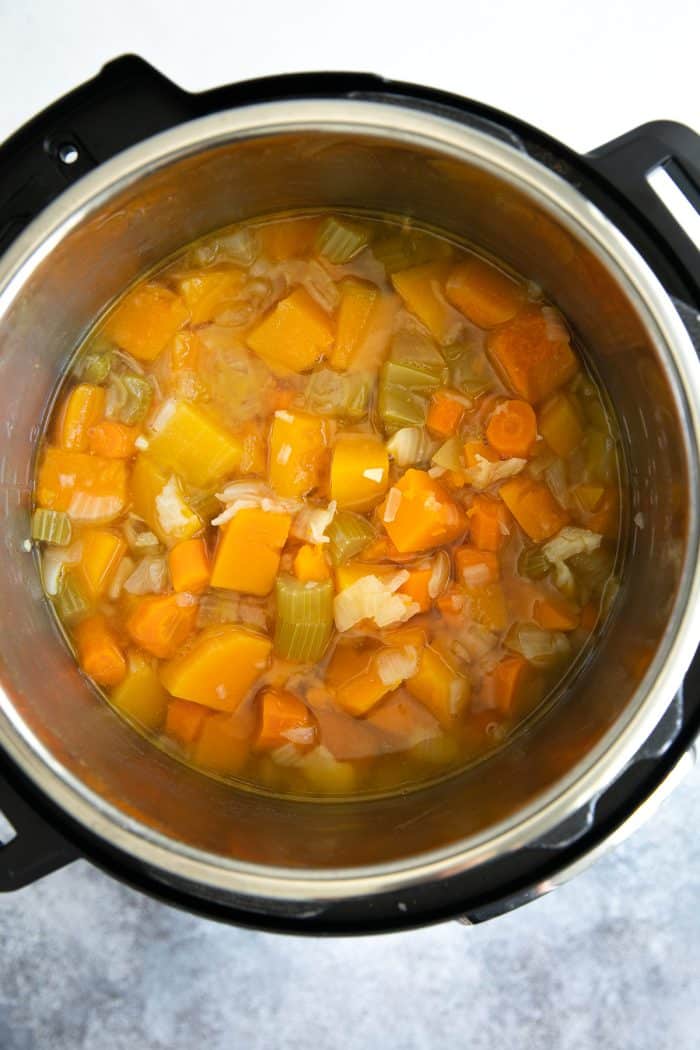Instant Pot filled with cooked vegetables and butternut squash