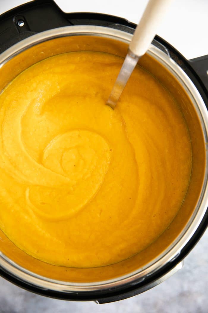 Instant Pot filled with creamy blended butternut squash soup