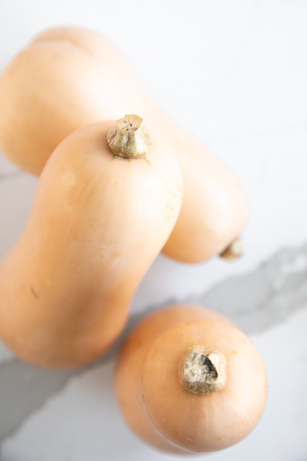 Whole and halved butternut squash.