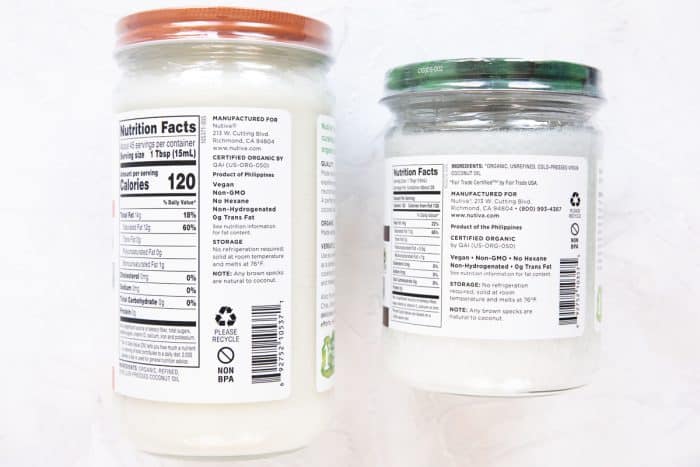 The back label of two jars of coconut oil, one which is refined and one which is not.