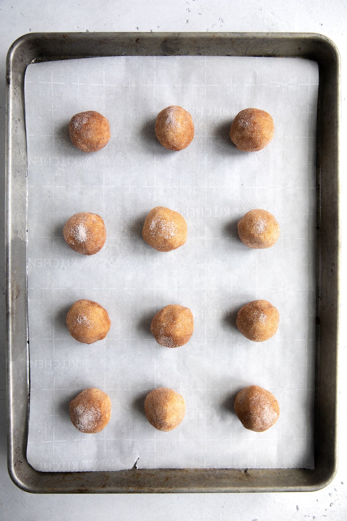 Baking sheet with 12 ball of cookie dough