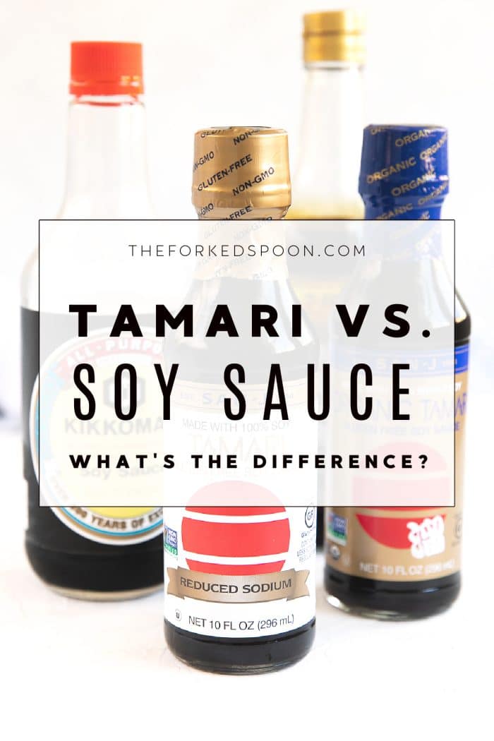 Bottles of soy sauce and tamari set on a table.