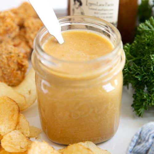 Jar of creamy homemade honey mustard sauce.