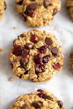 Cookies made with granola, almond flour rolled oats, maple syrup, chocolate chips, flax seeds, chia seeds, pumpkin, dried cranberries, and pumpkin seeds.