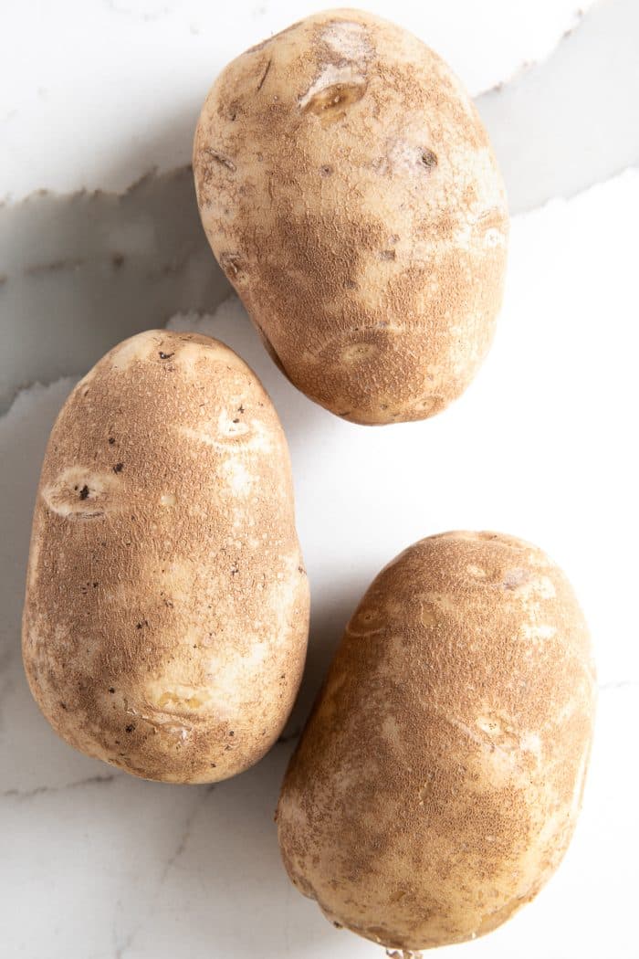 Three russet potatoes.