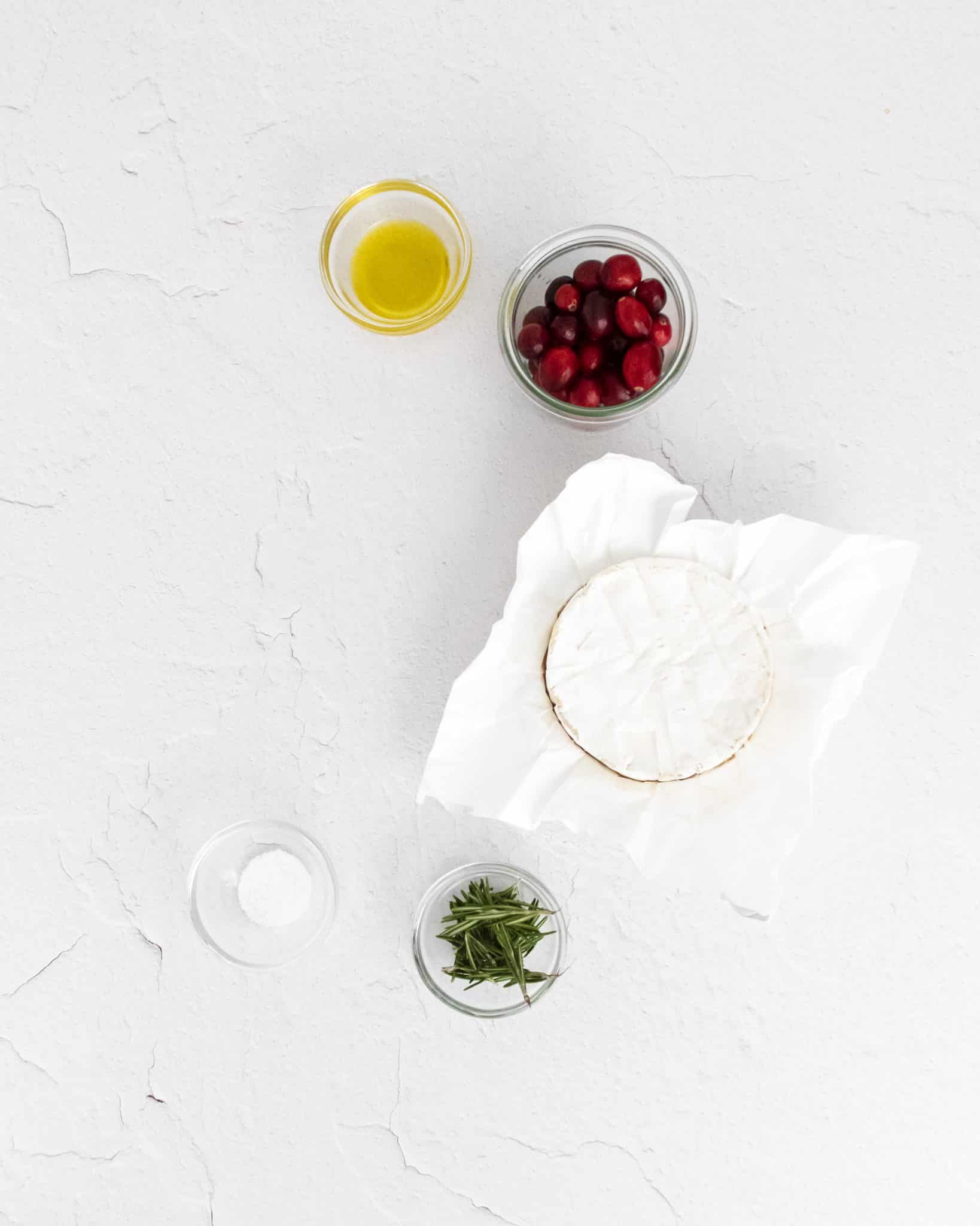 Five ingredients needed to make baked brie with roasted cranberries