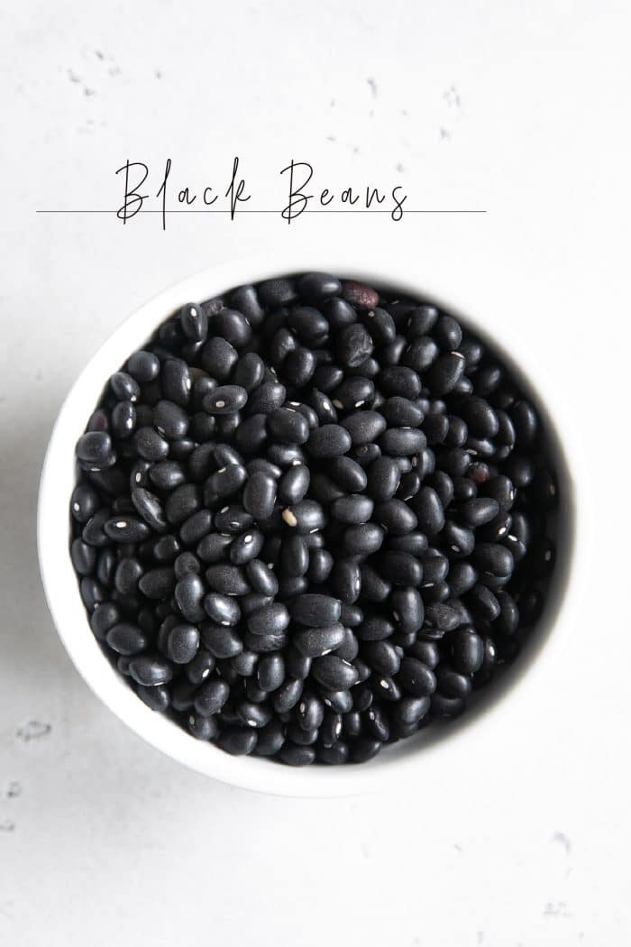 White ramekin filled with dried black beans