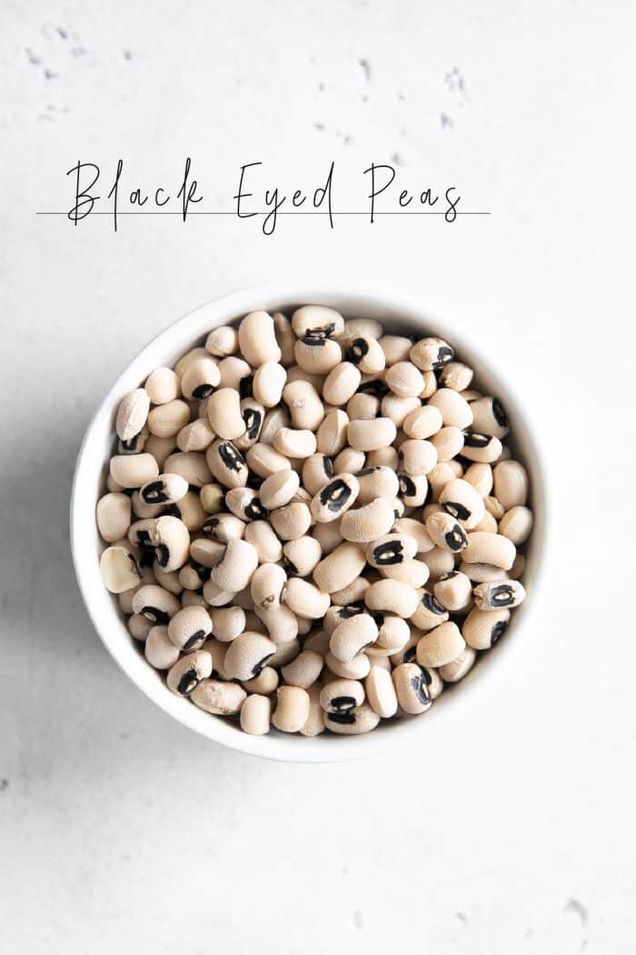 White ramekin filled with dried black eyed peas.