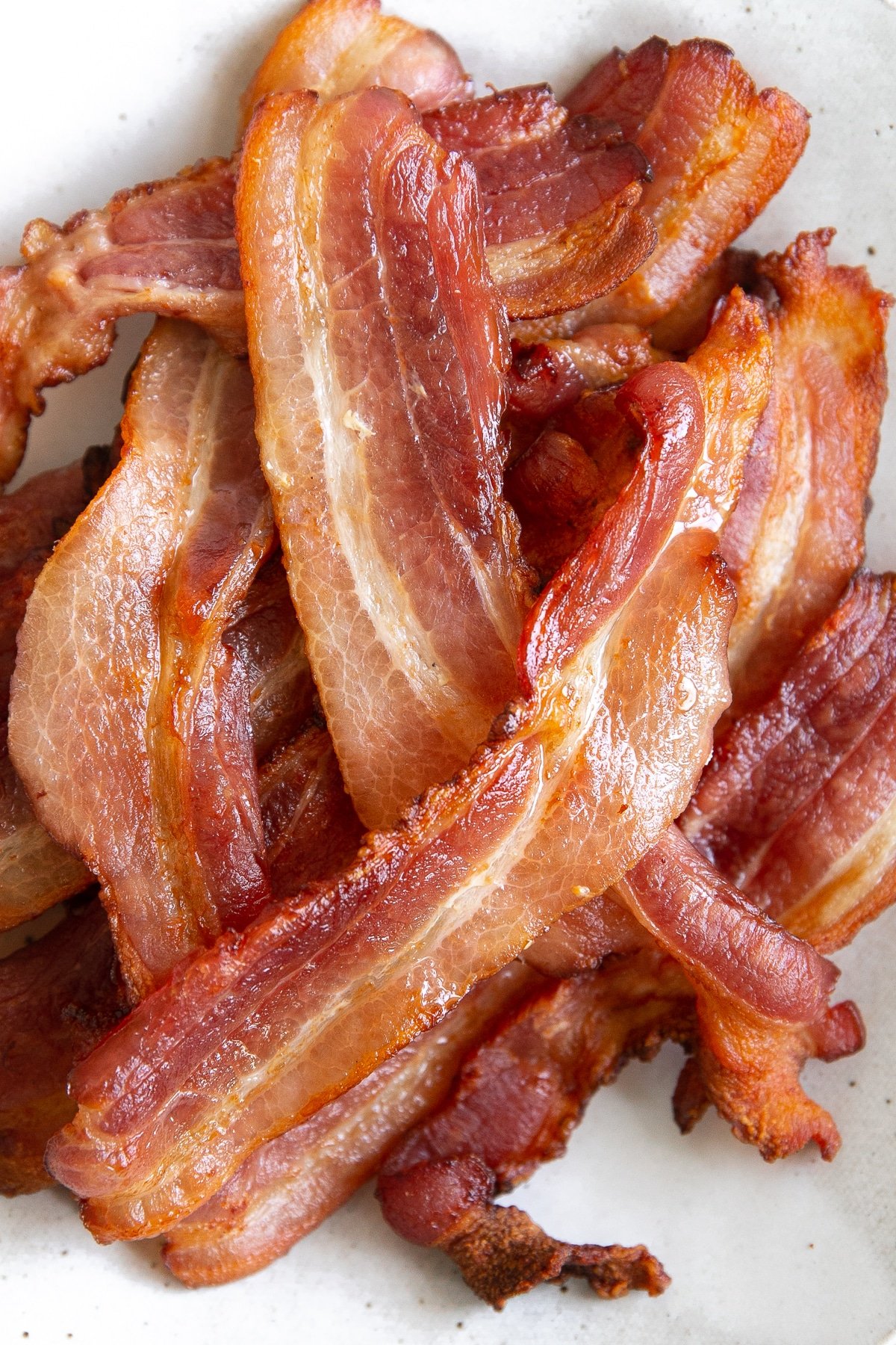 Close up image of cooked bacon that was cooked in an air fryer.