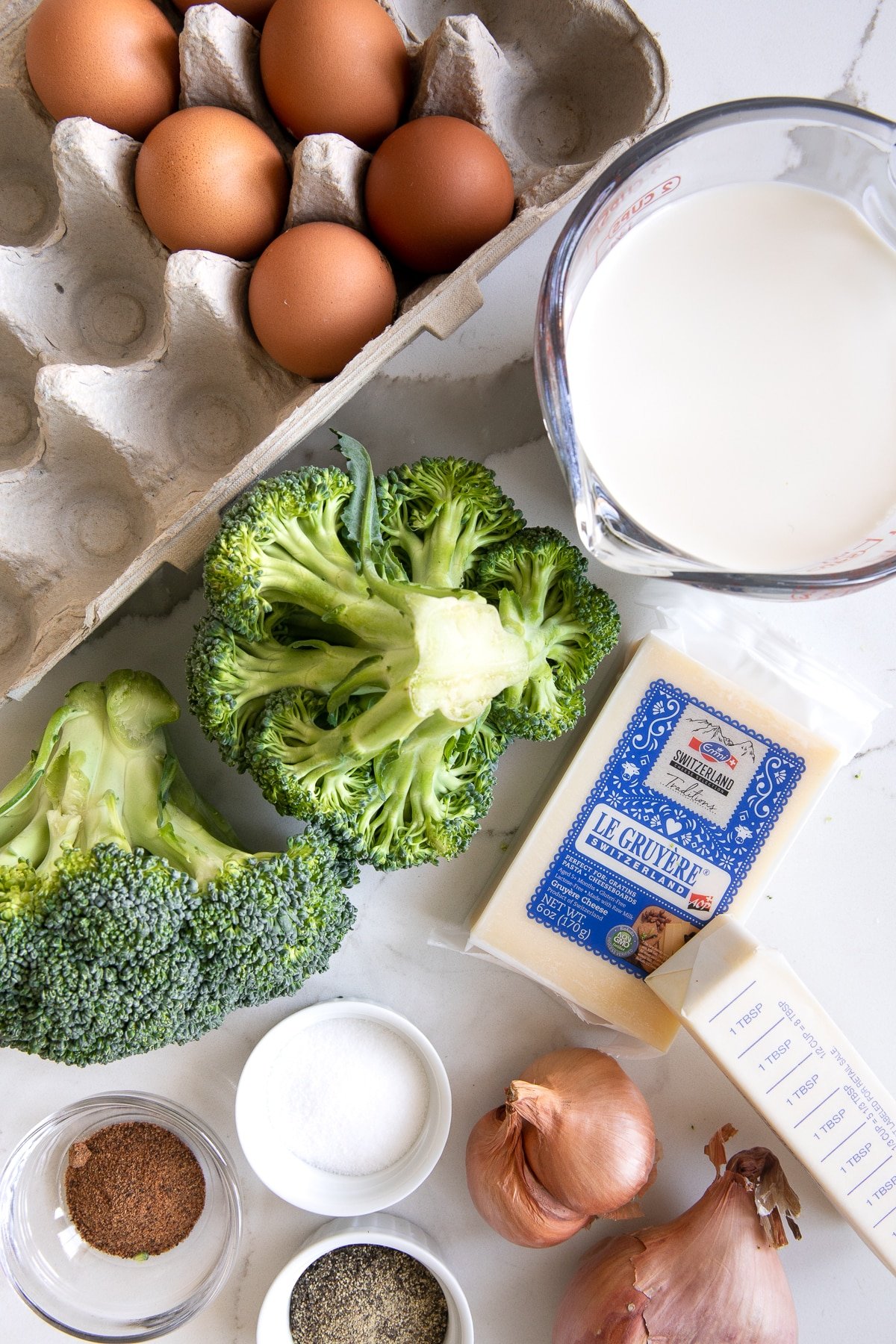 Image of the ingredients needed to make a simple crustless quiche with broccoli.