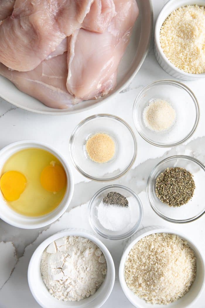 Image of all the ingredients needed to make parmesan crusted chicken breasts.