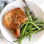 Pinterest Pin image for Honey Garlic Pork Chops recipe with one image and text overlay.