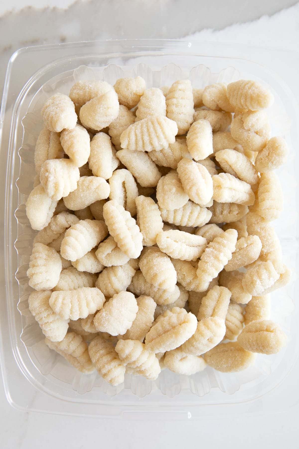 Plastic package filled with pre-made potato gnocchi.