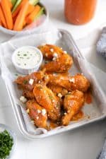 Buffalo wings cooked in the air fryer and tossed with homemade buffalo sauce and sprinkled with blue cheese.
