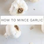 Image of whole bulbs of garlic with text overlay