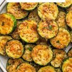 Roasted zucchini slices topped with golden cheese, labeled โEasy Parmesan Roasted Zucchini.โ