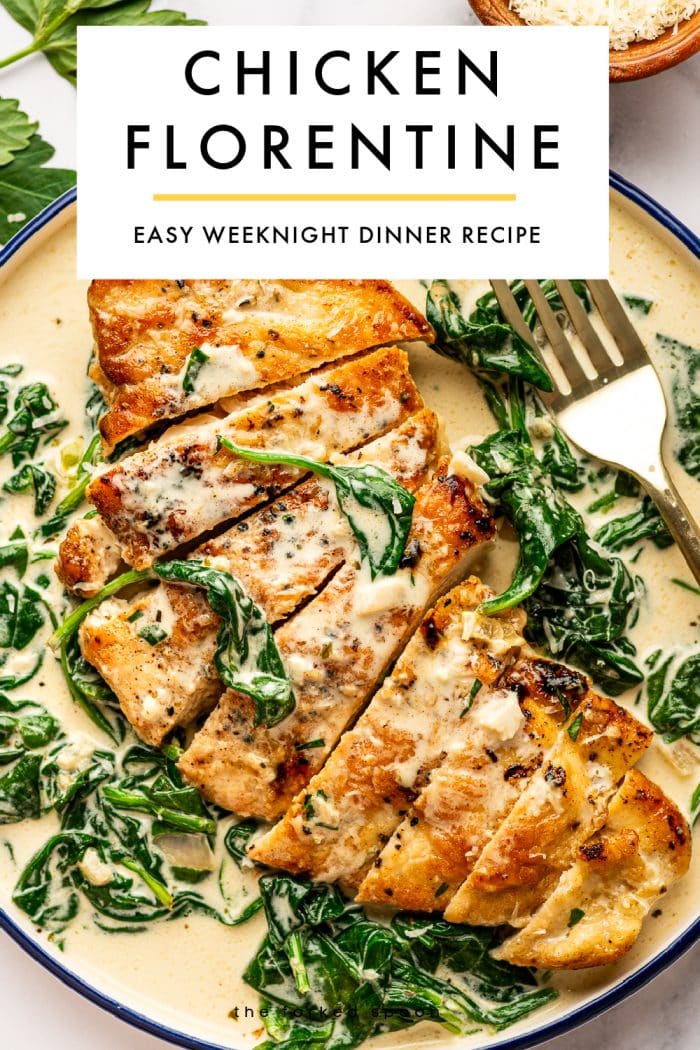 Vertical Pinterest pin for Chicken Florentine featuring a plated serving of sliced chicken in creamy spinach sauce in a cream-colored bowl with a dark blue rim. A gold fork rests on the right side of the bowl, and fresh parsley leaves and a wooden bowl of grated parmesan appear around the edges. At the top, a large light gray text box contains black uppercase text reading “CHICKEN FLORENTINE” and smaller uppercase text below reading “EASY WEEKNIGHT DINNER RECIPE,” separated by a thin golden-yellow line. Small black text at the bottom reads “theforkedspoon.com.”