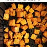 Air fryer basket filled with evenly roasted cubes of butternut squash, golden and caramelized on the edges, showing a simple vegan and low-carb side dish.